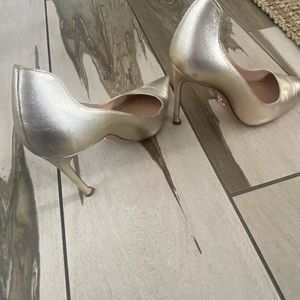 Christian Dior gold heels.